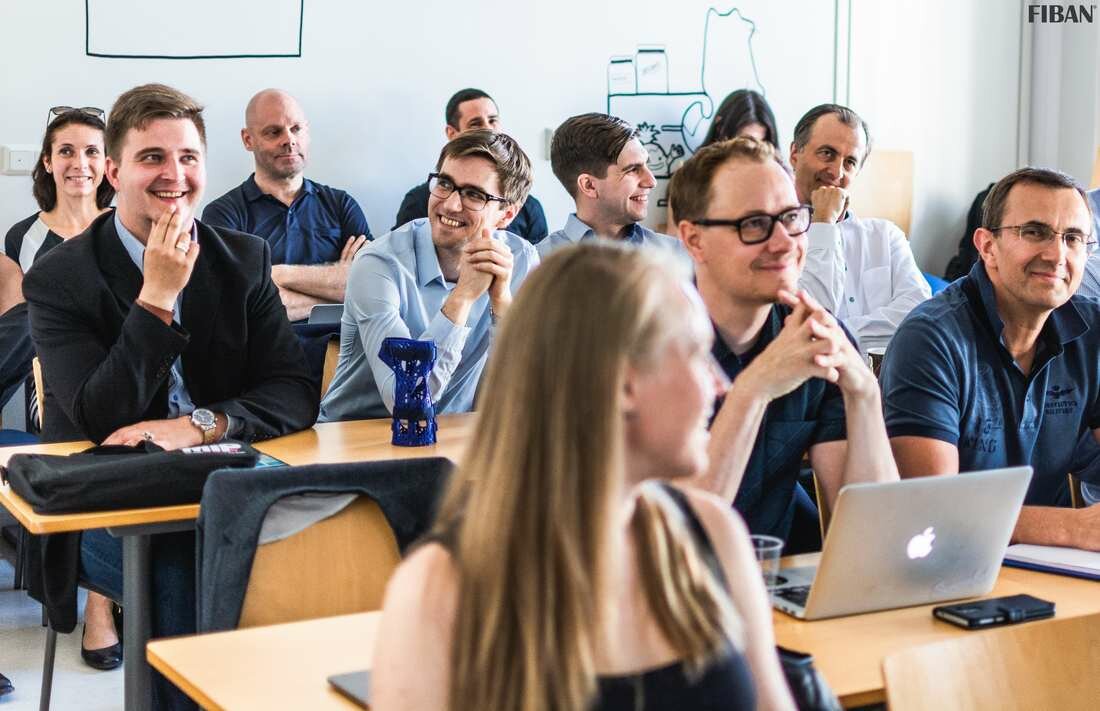 Participants seated at desks listening during a Nordic Angel Program session hosted by FiBAN